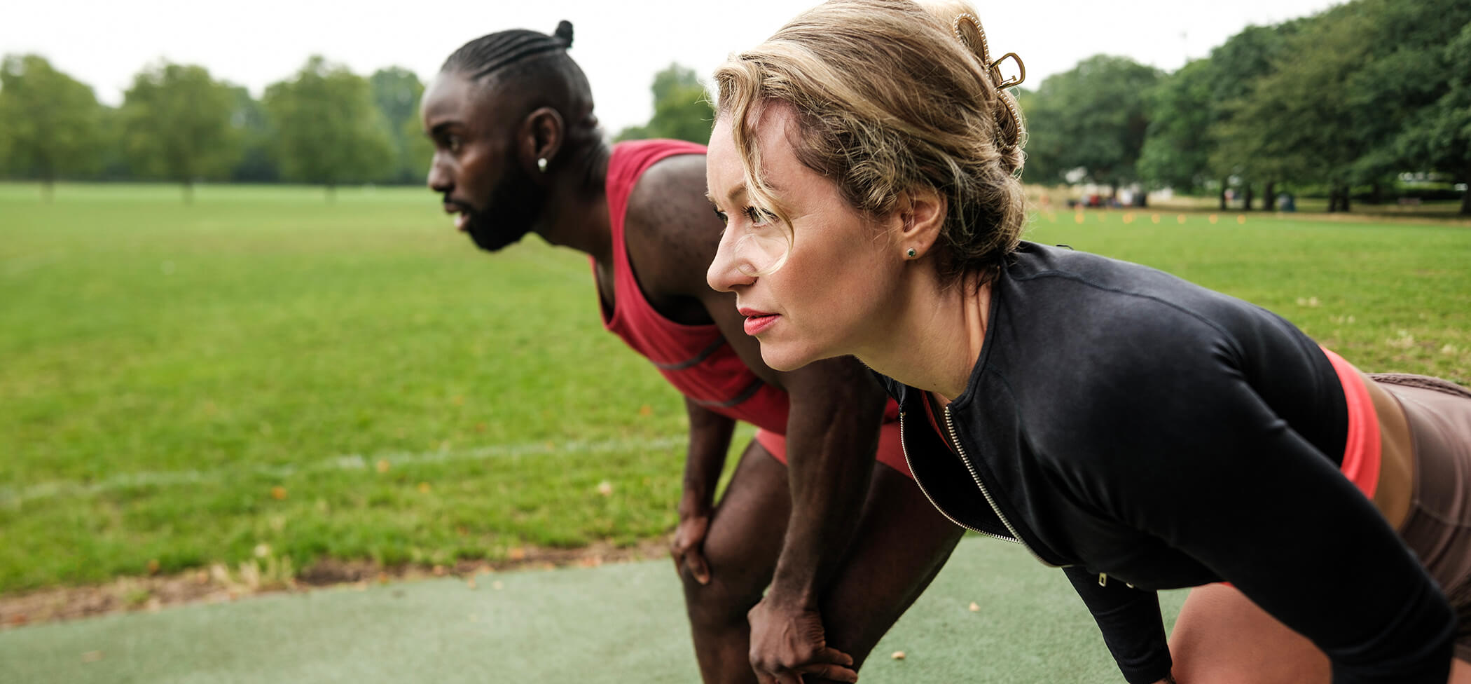 athletes-recovering-after-training-in-a-park-two-2025-09-06-19-57-13-utc
