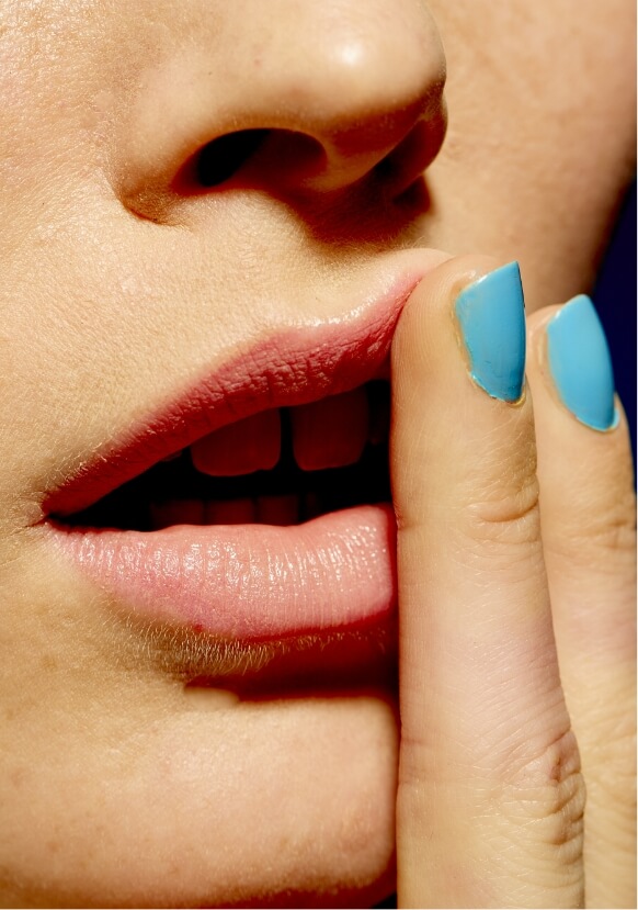 close-up-of-a-woman-touching-their-lips-with-turqu-2025-04-11-21-27-10-utc