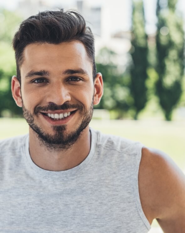 close-up-shot-of-smiling-young-man-looking-at-came-2024-11-17-08-46-55-utc