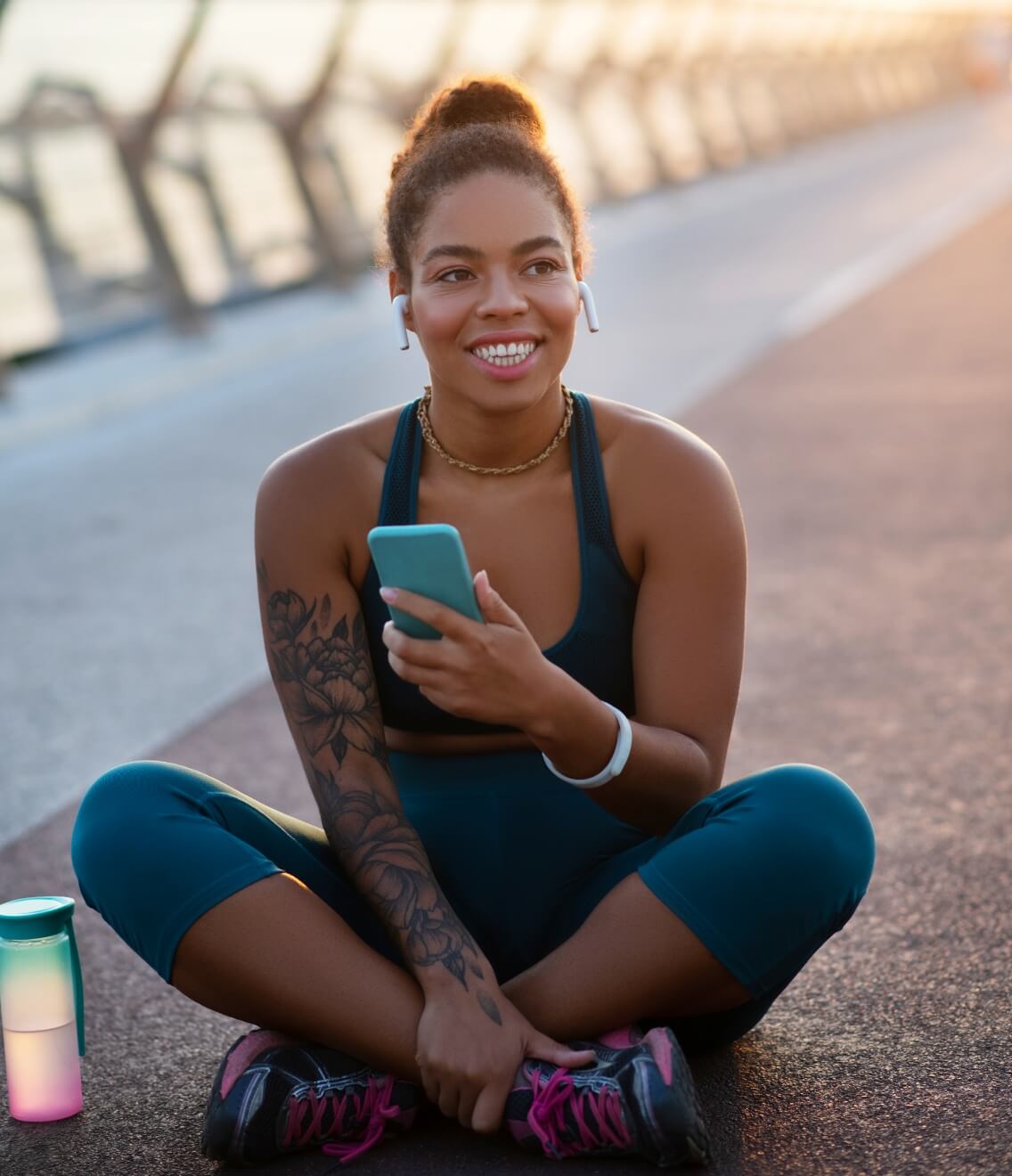 dark-skinned-smiling-woman-sitting-on-bridge-after-2024-10-18-03-19-47-utc (1)